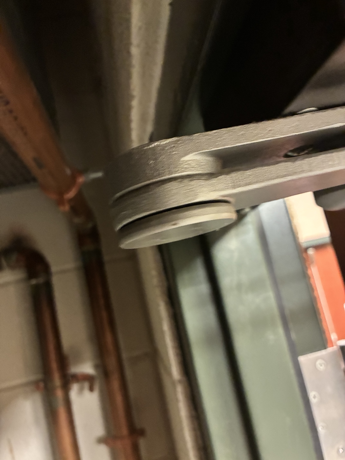 Close-up of pivot joint on a commercial door closer arm