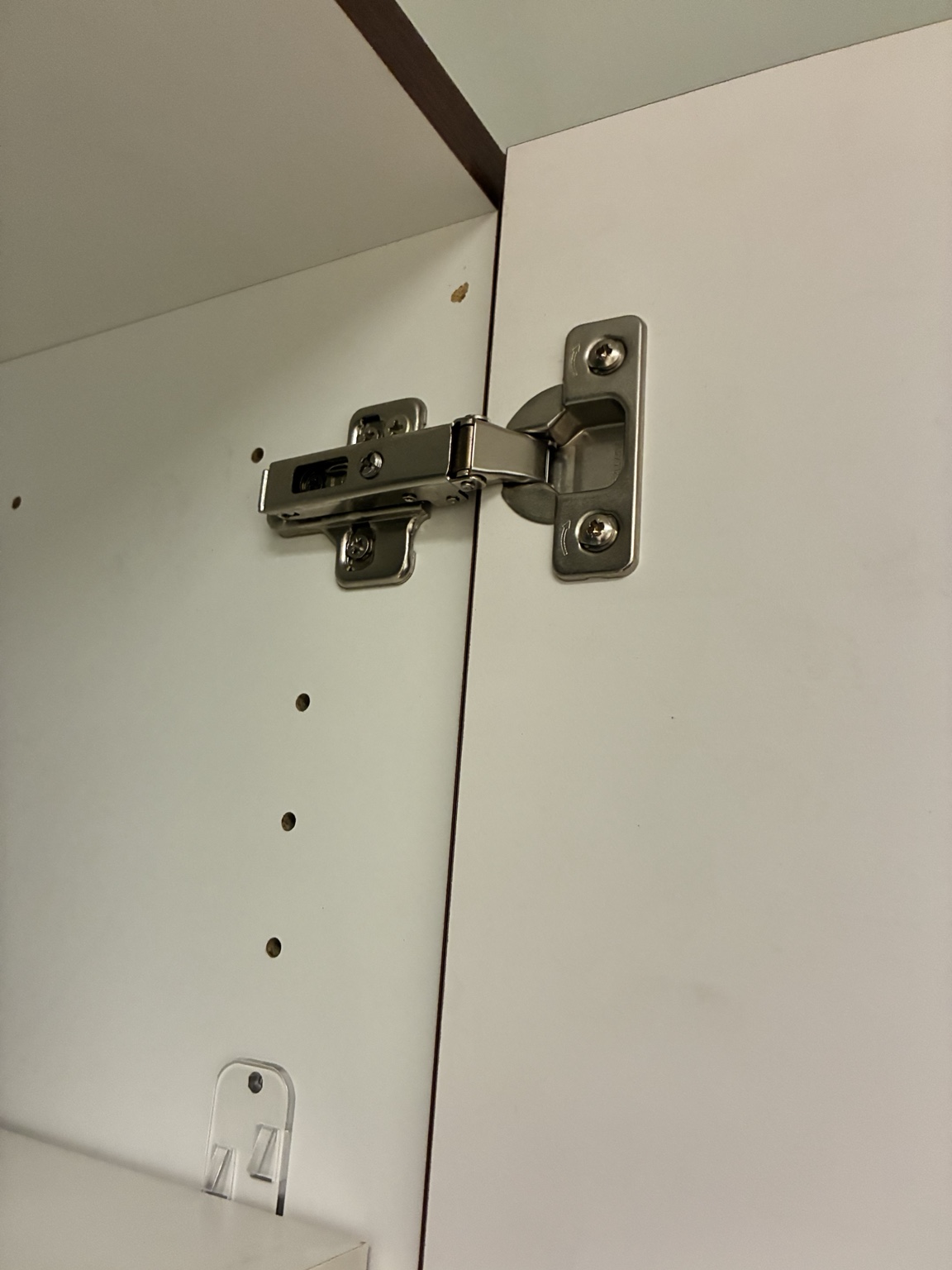Concealed cabinet hinge viewed from below