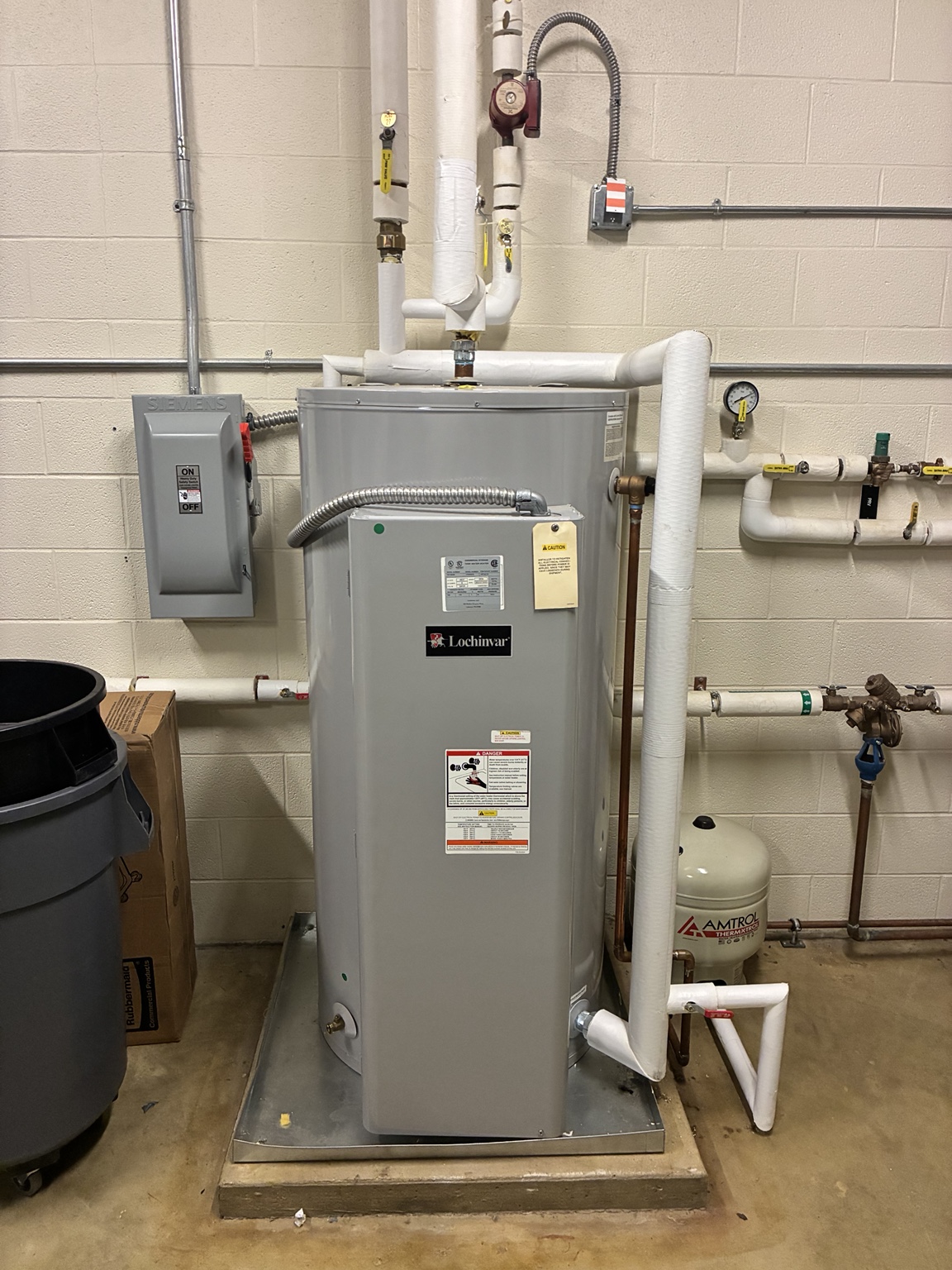 Commercial storage water heater with connected piping