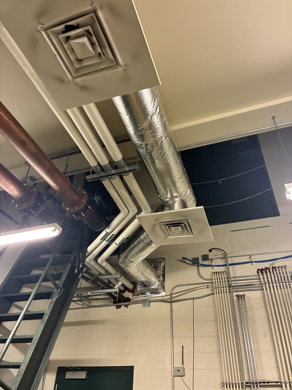 Commercial hot water distribution piping above ceiling level