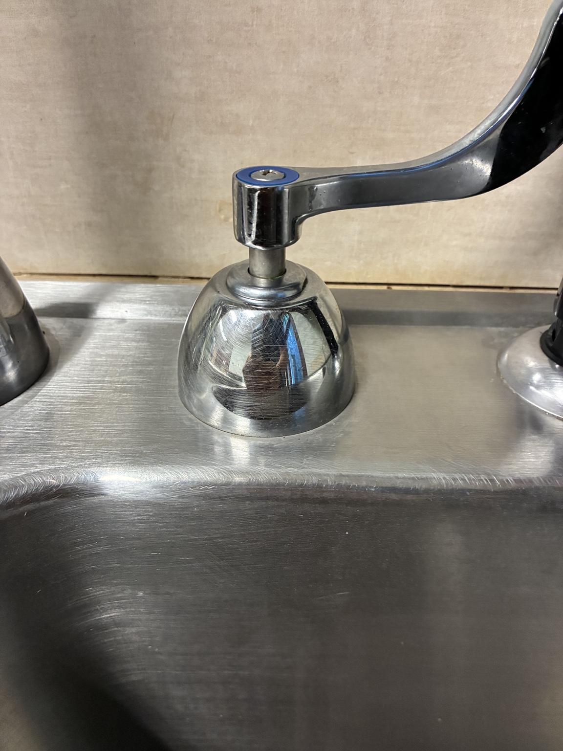 Close-up of a commercial faucet handle