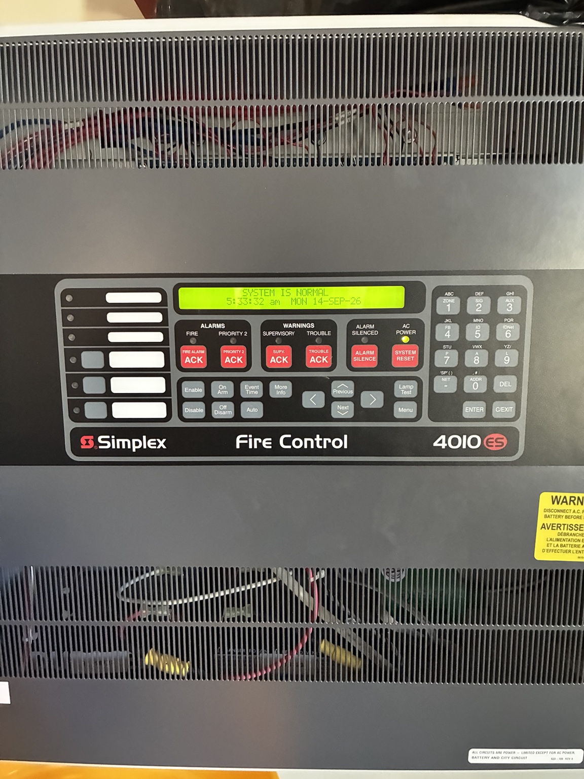 Commercial fire alarm control panel used as a field example