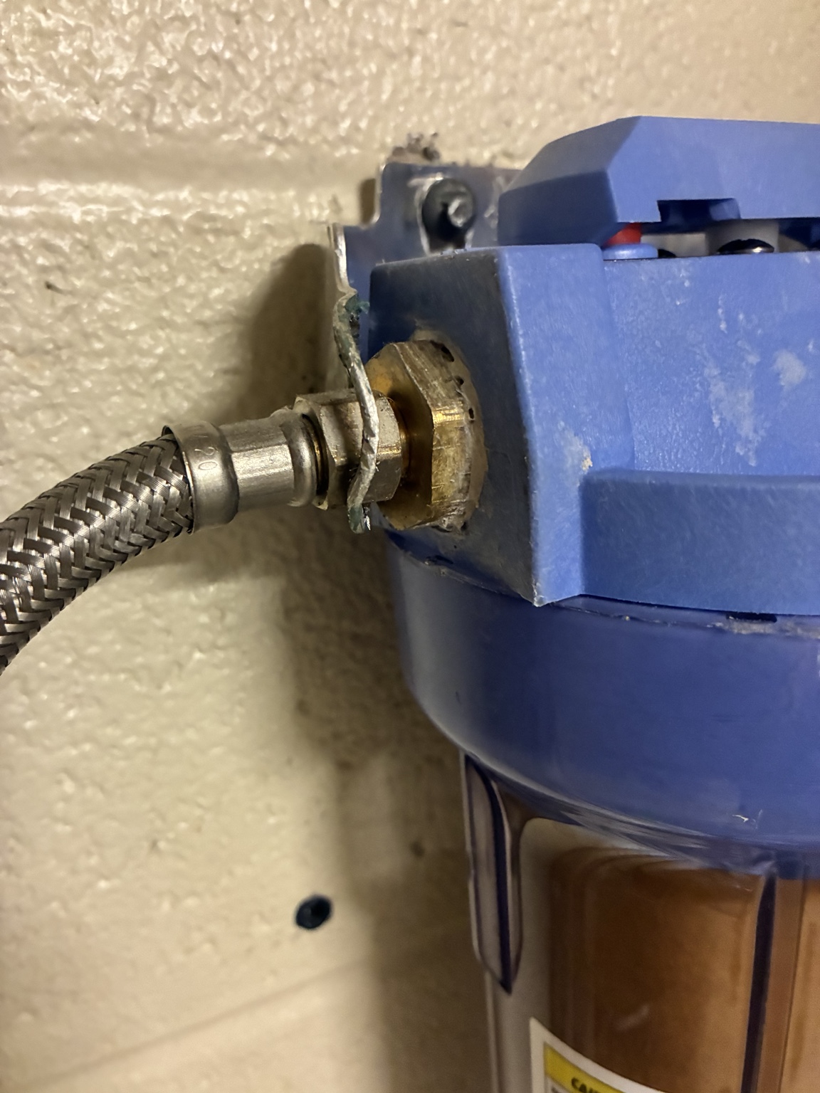 Braided water connection at ice machine filter inlet