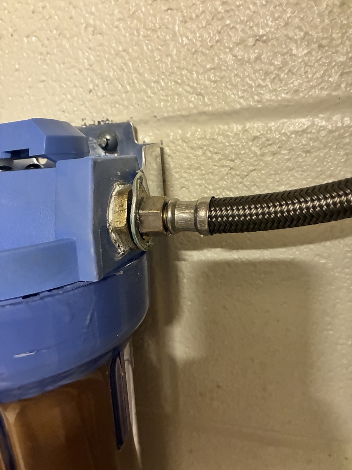 Braided water connection at ice machine filter outlet